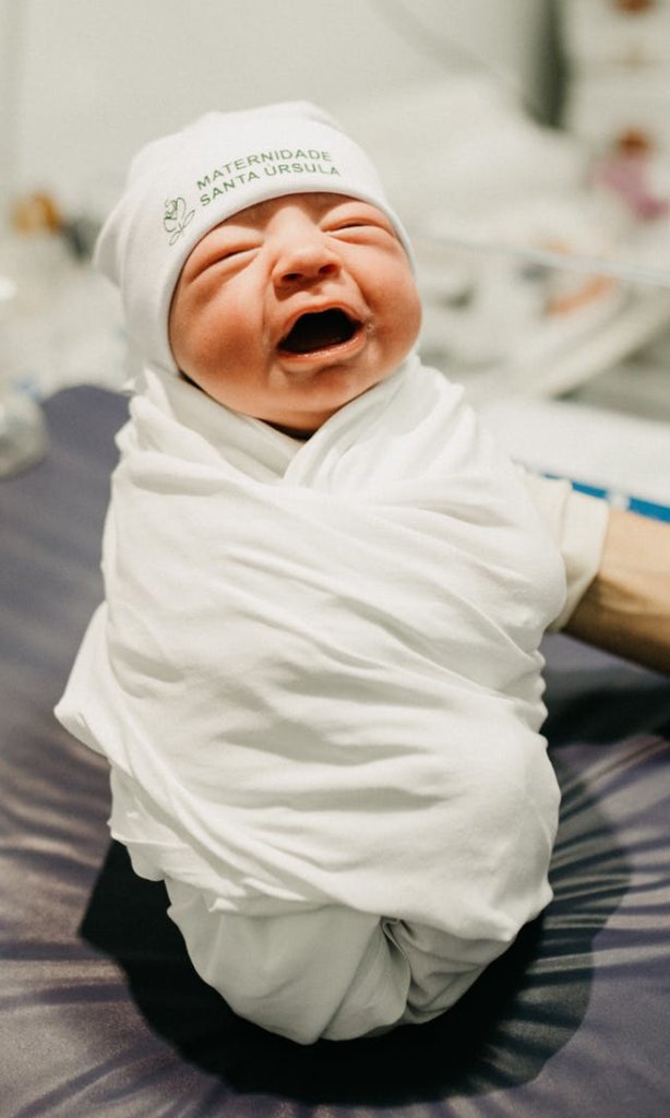 https://www.pexels.com/photo/baby-wrapped-in-white-cloth-3259626/